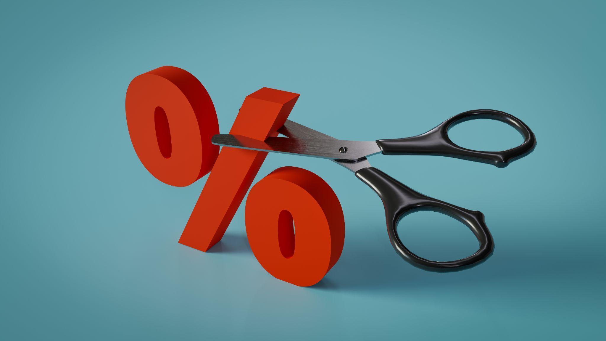 scissors cutting a percentage sign
